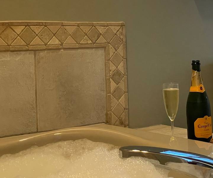 The corner jacuzzi tub in the primary bathroom