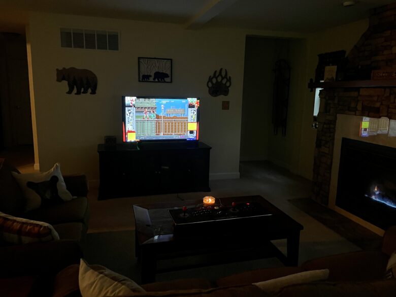 The retro arcade machine in the lower level