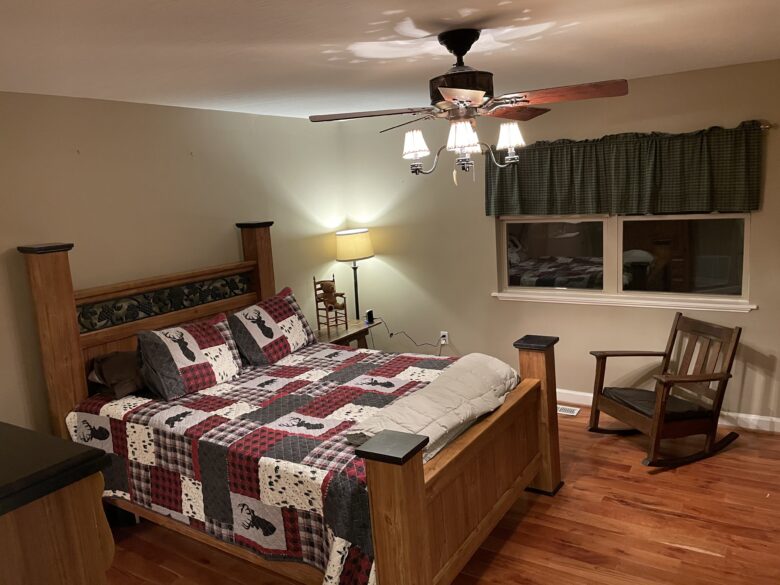 The Main Level Master Suite: queen bed on a wood floor