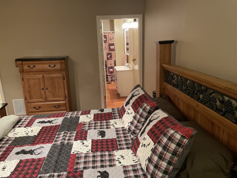 The Main Level Master Suite looking through to its own private full bathroom