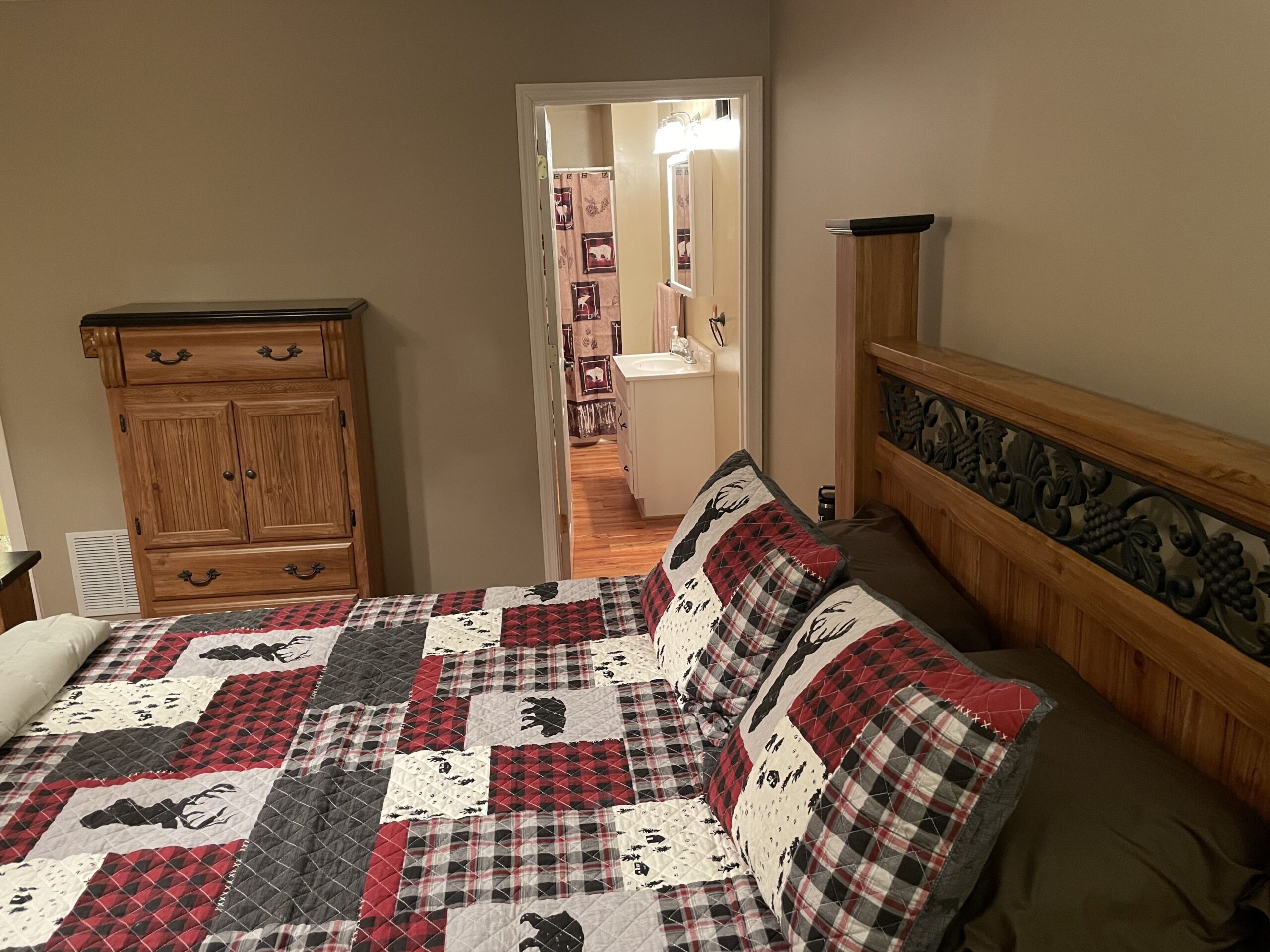 The Main Level Master Suite looking through to its own private full bathroom